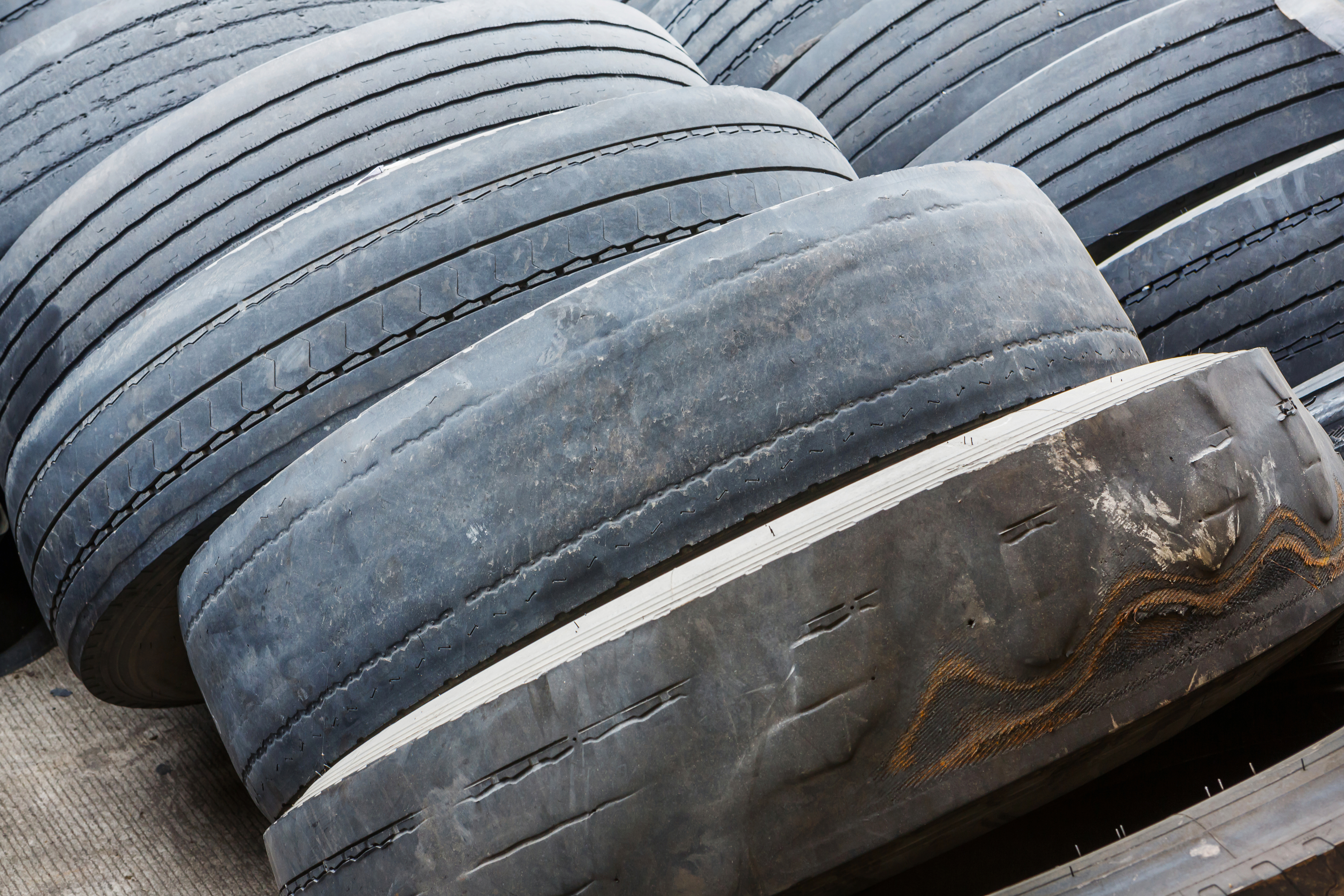 a stack of worn tires