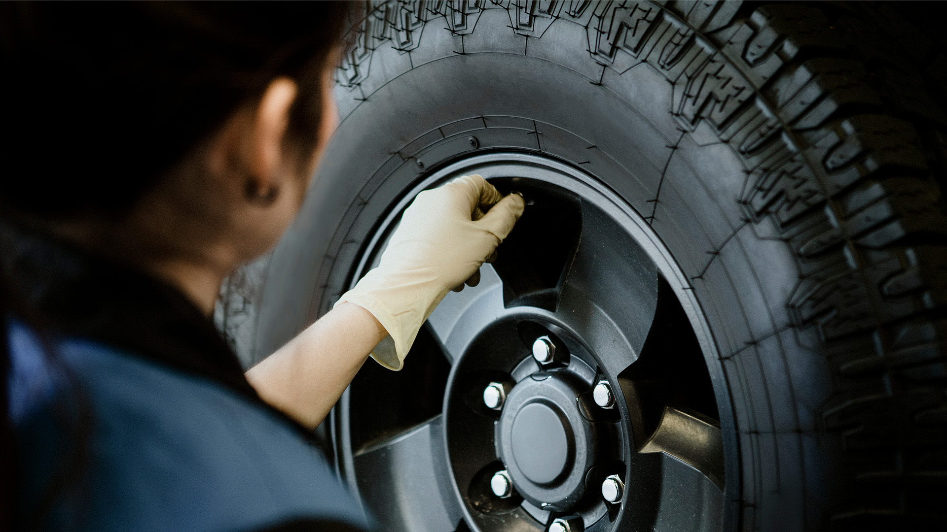 mechanic checking a valve stem